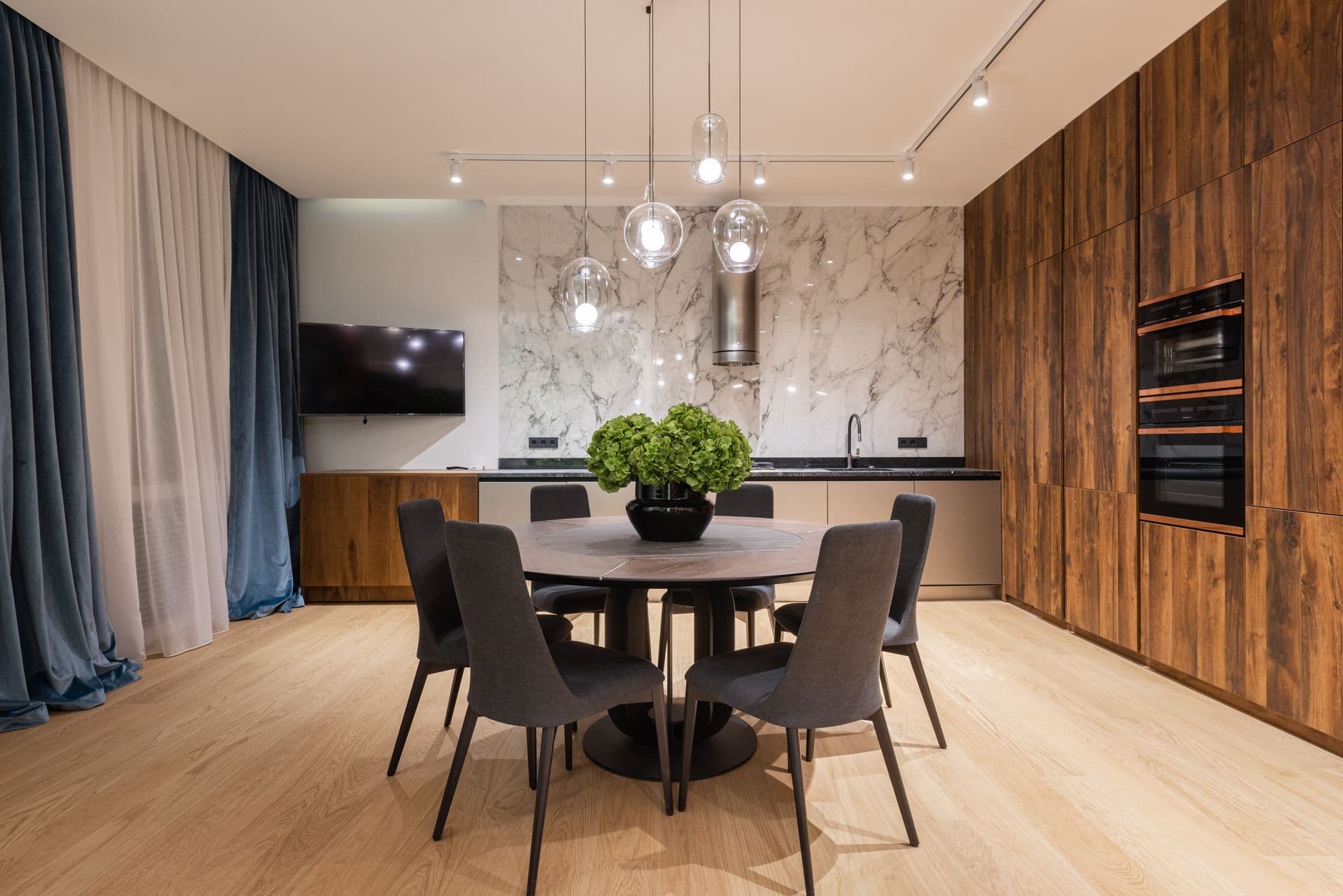 For a round or square table, cluster three to five small pendants